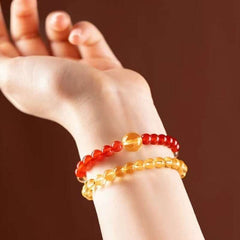 Close-up look of genuine citrine and grounding carnelian stones from AURA LITH healing crystal jewelry.
