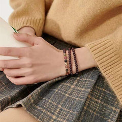Protective tourmaline bracelet from AURA LITH, perfect for aura shielding and root chakra balancing.