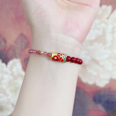 AURA LITH pink crystal bracelet worn on a wrist to channel celestial support and universal love for the Libra soul.