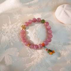 Handmade crystal jewelry featuring premium amethyst and soft rose quartz beads to support emotional balance and grace.