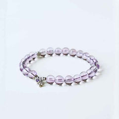 Handmade crystal jewelry featuring high-quality purple amethyst stones to support emotional balance and mental clarity.