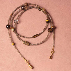 Handmade crystal jewelry featuring premium tiger's eye beads to support emotional balance, clarity, and prosperity.
