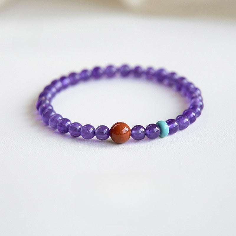 AURA LITH Sagittarius Wisdom Amethyst Zodiac Bracelet, a natural gemstone bracelet for spiritual exploration and higher wisdom.