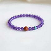 AURA LITH Sagittarius Wisdom Amethyst Zodiac Bracelet, a natural gemstone bracelet for spiritual exploration and higher wisdom.
