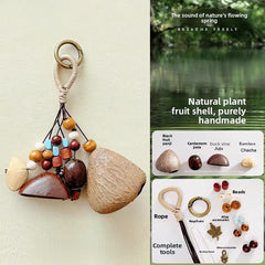 Product info graphic for the Natural Fruit Shell Wind Chime & Shaker DIY Kit, displaying a handmade finished charm on the left, and on the right, listing the raw materials including dried seed pods, beads, rope, keychain, and complete tools.