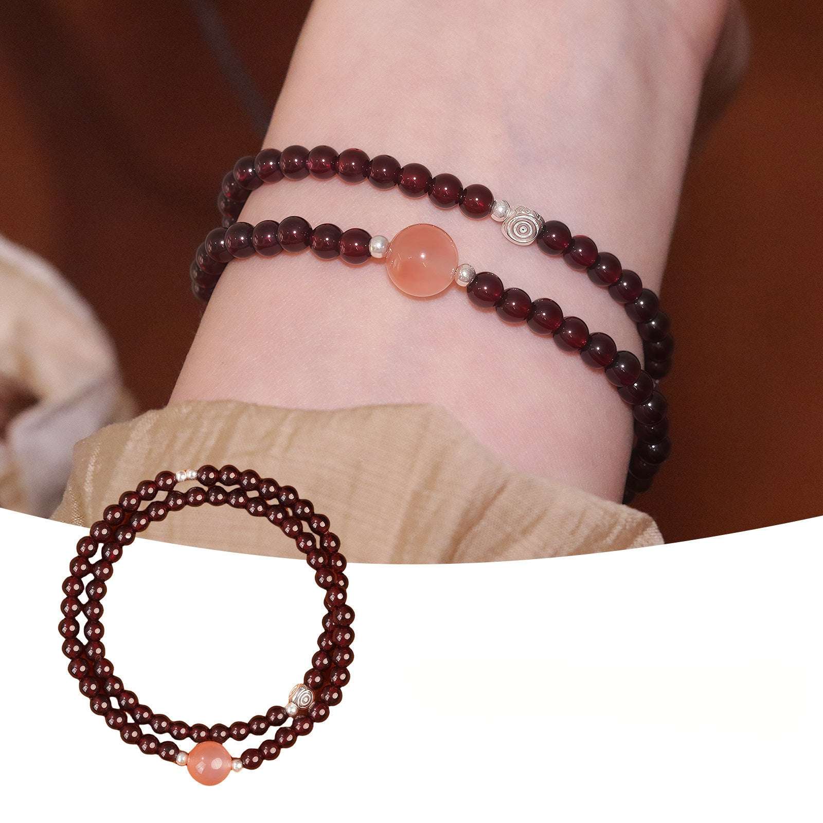 Handmade crystal jewelry featuring a premium carnelian and garnet beaded bracelet in single wrap style on a wearer's wrist.