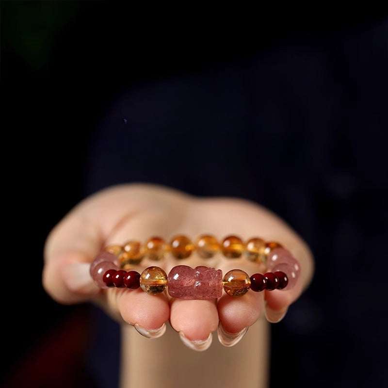 Handmade crystal jewelry featuring a premium yellow phantom quartz and citrine beaded bracelet worn on a wrist.