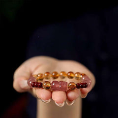 Handmade crystal jewelry featuring a premium yellow phantom quartz and citrine beaded bracelet worn on a wrist.