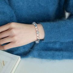 Handmade crystal jewelry featuring premium clear quartz and serene aquamarine beads to support emotional healing.