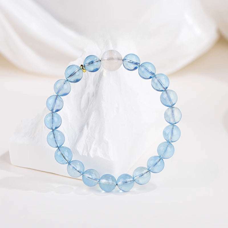 Close-up look of genuine 7A grade aquamarine crystals and spiritual gemstone jewelry by AURA LITH.
