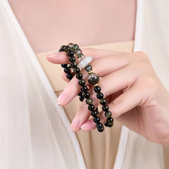 Close-up look of genuine 7A grade green phantom quartz beads and rich protective stones from AURA LITH gemstone jewelry.