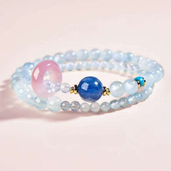 Close-up look of genuine 7A grade amethyst and calming aquamarine stones from AURA LITH gemstone jewelry.
