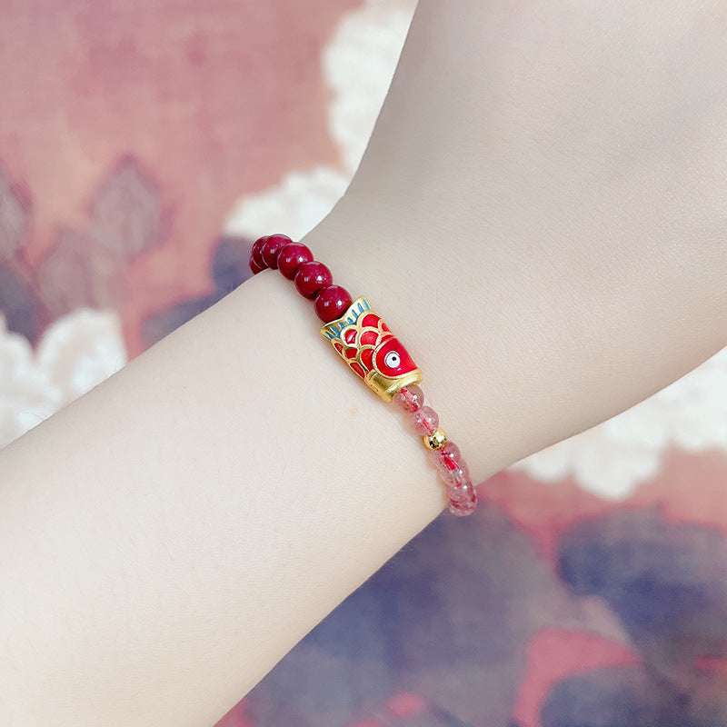 Close-up look of genuine strawberry quartz beads and spiritual gemstone jewelry for cosmic protection by AURA LITH.