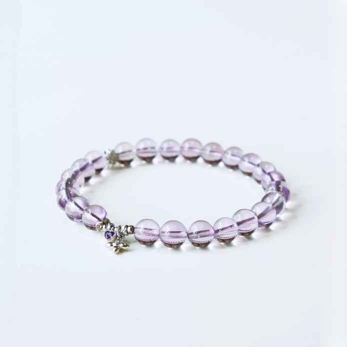 Handmade crystal jewelry featuring high-quality purple amethyst stones to support emotional balance and mental clarity.