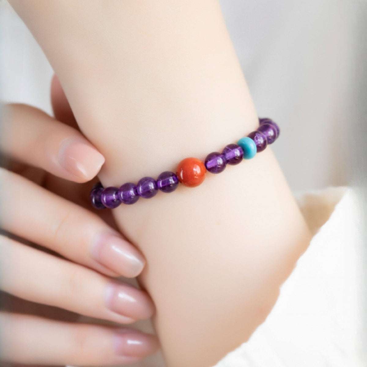 Close-up look of genuine 6mm amethyst stones and spiritual gemstone jewelry for Sagittarius alignment by AURA LITH.