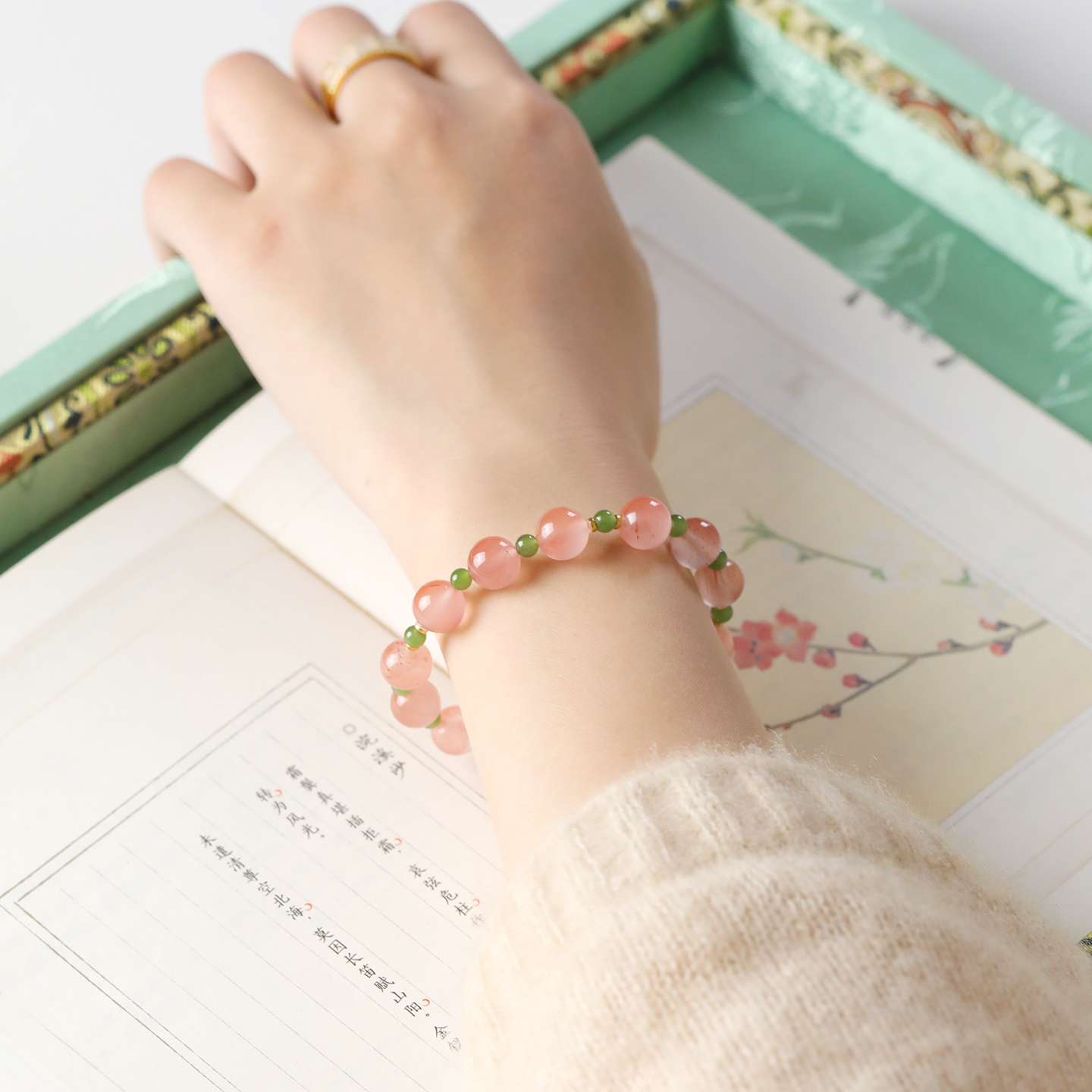 AURA LITH balancing crystal bracelet worn on a wrist for deep grounding energy and shielding your aura.
