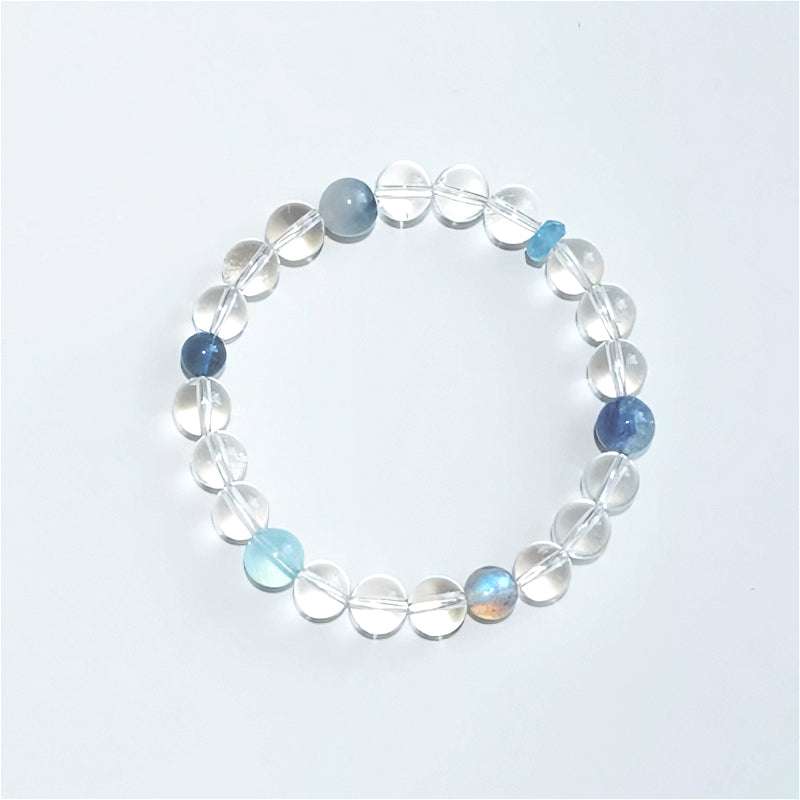 Elegant clear quartz and aquamarine beaded bracelet variant from AURA LITH, enhancing intuition and mental clarity.