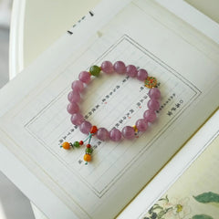 Close-up look of genuine 7A grade amethyst stones and protective rose quartz from AURA LITH cosmic protection jewelry.