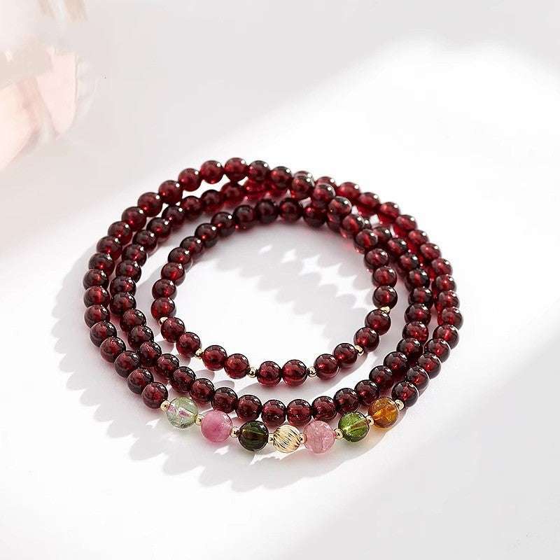 AURA LITH Root Grounding Garnet Chakra Bracelet, a natural gemstone bracelet for root alignment and cosmic protection.