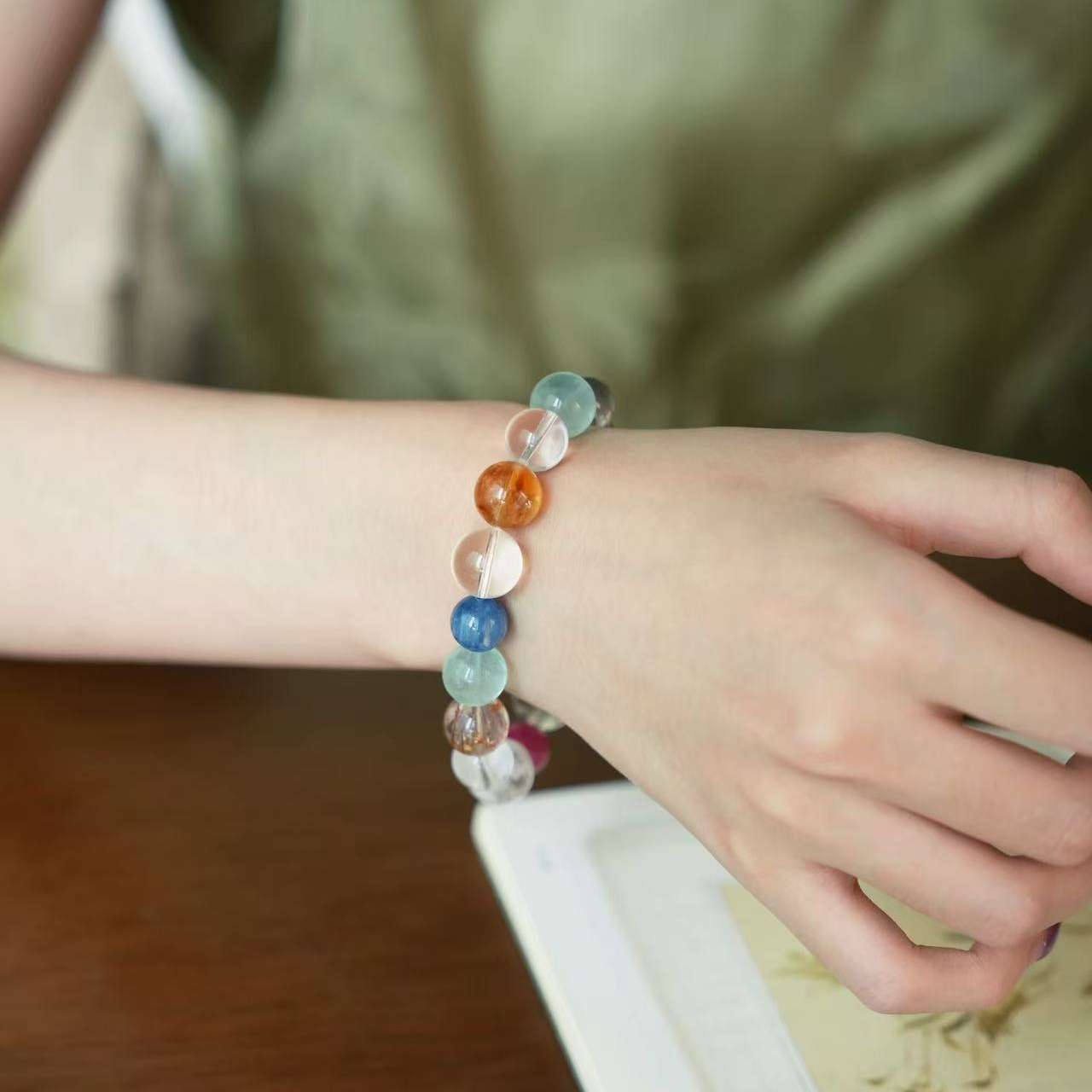 AURA LITH Rose Island Crystal Bracelet variant worn on a wrist for deep aura shielding and inner harmony.