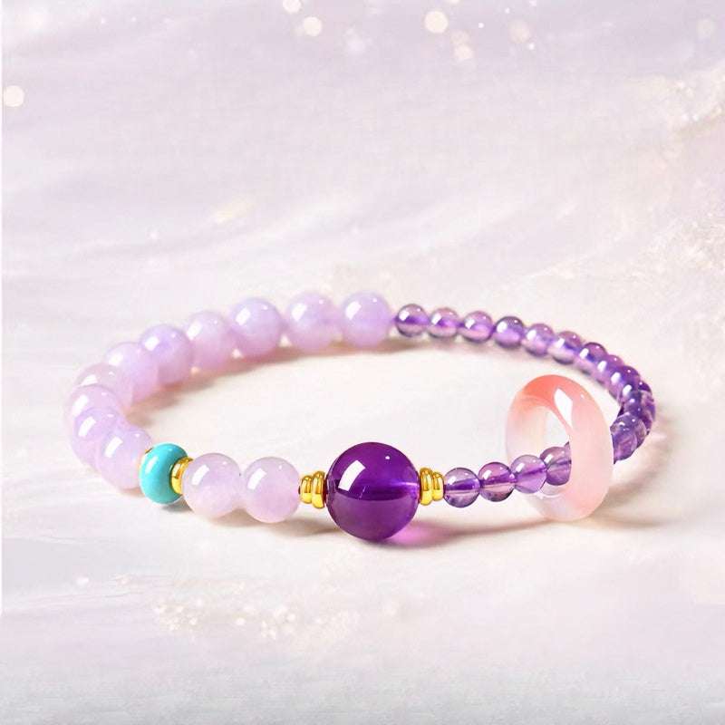 Close-up look of genuine 7A grade intense purple amethyst beads from AURA LITH cosmic protection jewelry.