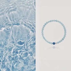 AURA LITH Tranquility & Light Aquamarine and Kyanite Minimalist Bracelet, a delicate natural gemstone bracelet designed to quiet the mind.