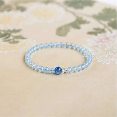 Handmade crystal jewelry featuring premium kyanite and clear quartz 4mm fine beads to support inner alignment and peace.