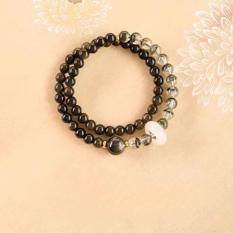 Handmade crystal jewelry featuring a premium green phantom quartz zodiac bracelet worn to bring mental order.