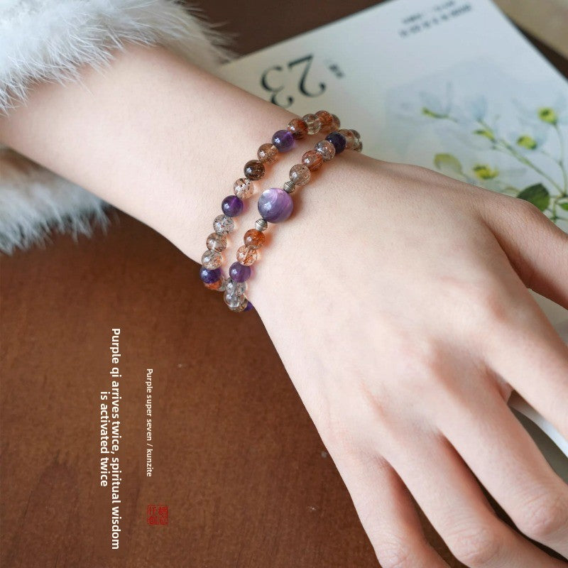 AURA LITH healing purple crystal bracelet worn on a wrist for shielding your aura and connecting to higher awareness.