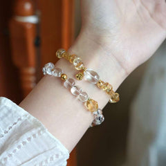AURA LITH Yucheng style citrine crystal bracelet worn on a wrist for deep aura shielding and expanding positive energy.